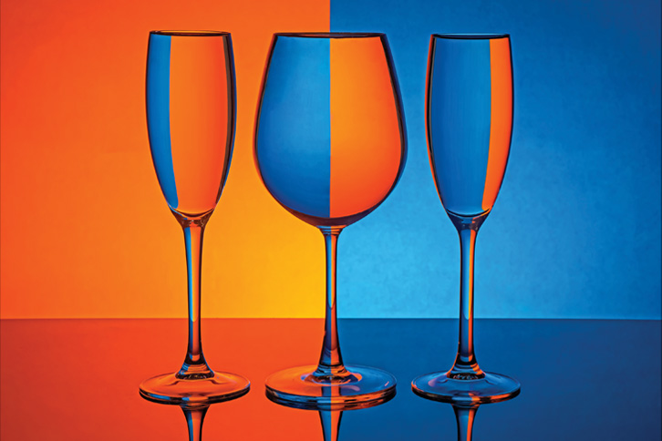 three glasses with alternating blue and orange colors